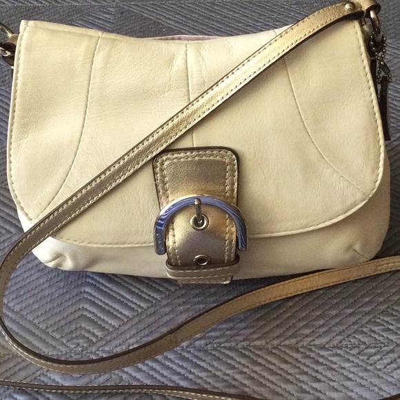 Coach Handbags - Coach cream leather crossbody bag with silver tone hardware and gold accents
